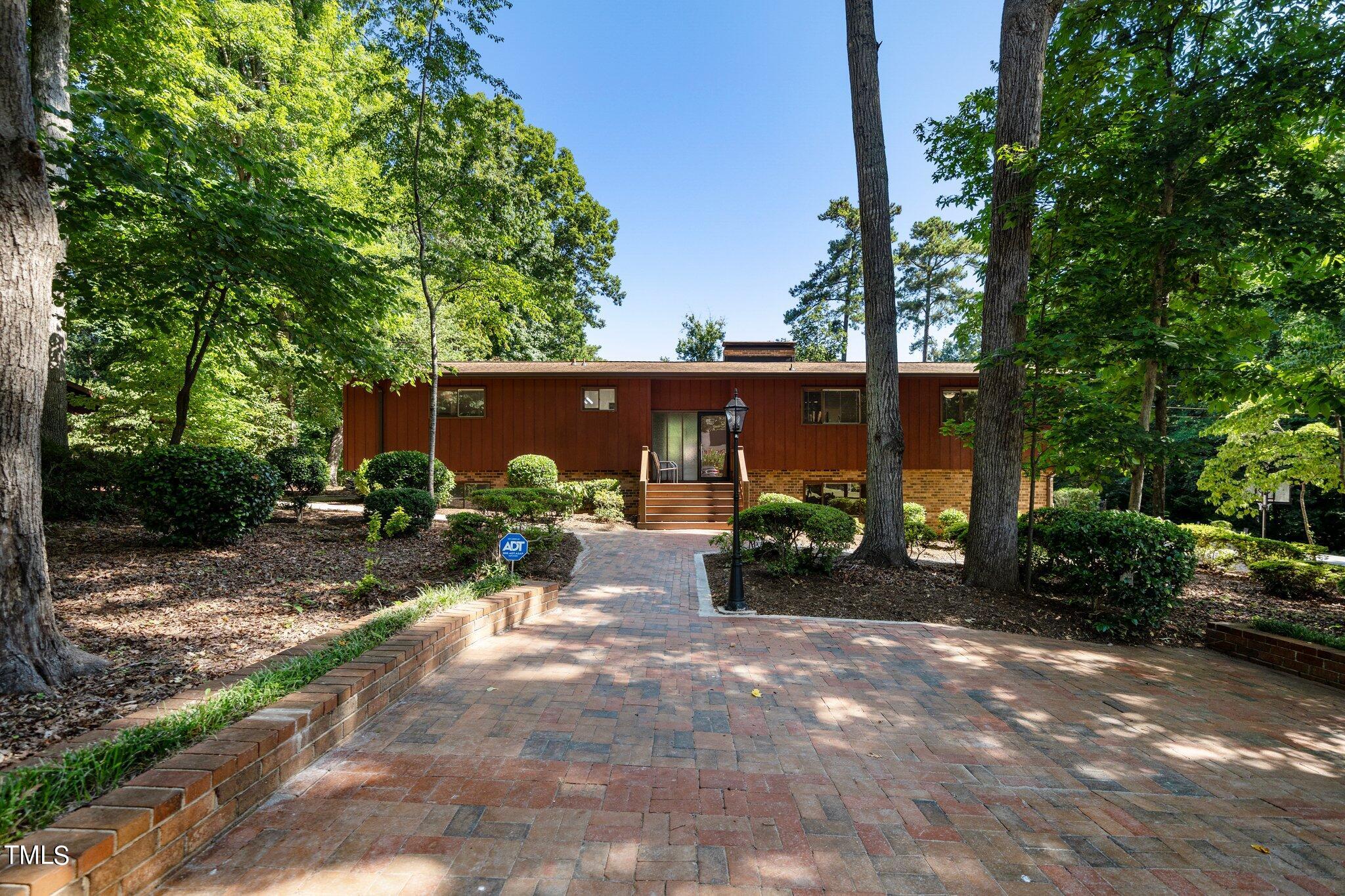 6406 Arnold Road Raleigh, NC 27607 - Photo 1 of 44 a view of a house with yard and sitting area