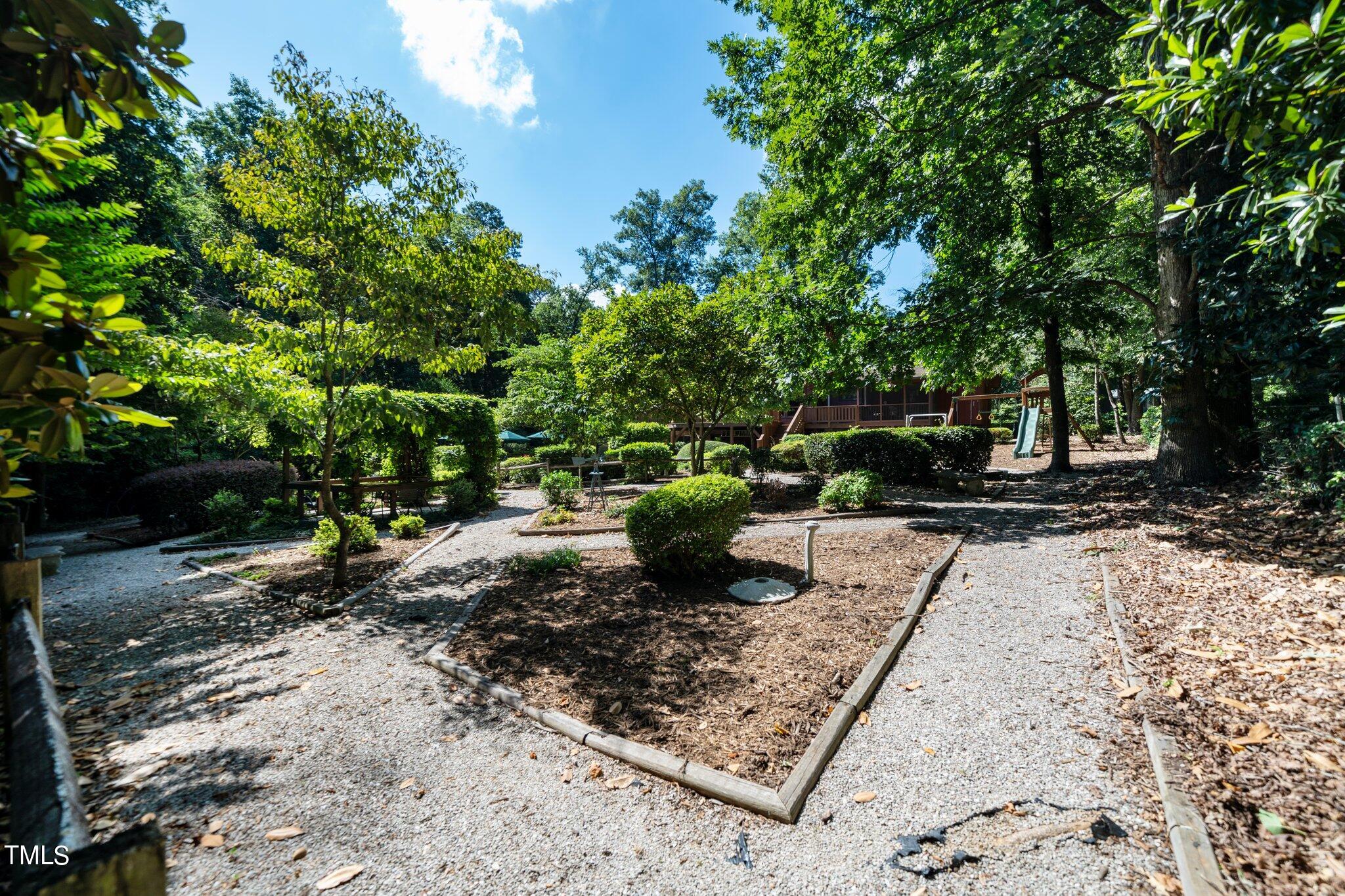 6406 Arnold Road Raleigh, NC 27607 - Photo 13 of 44 a view of a garden with plants
