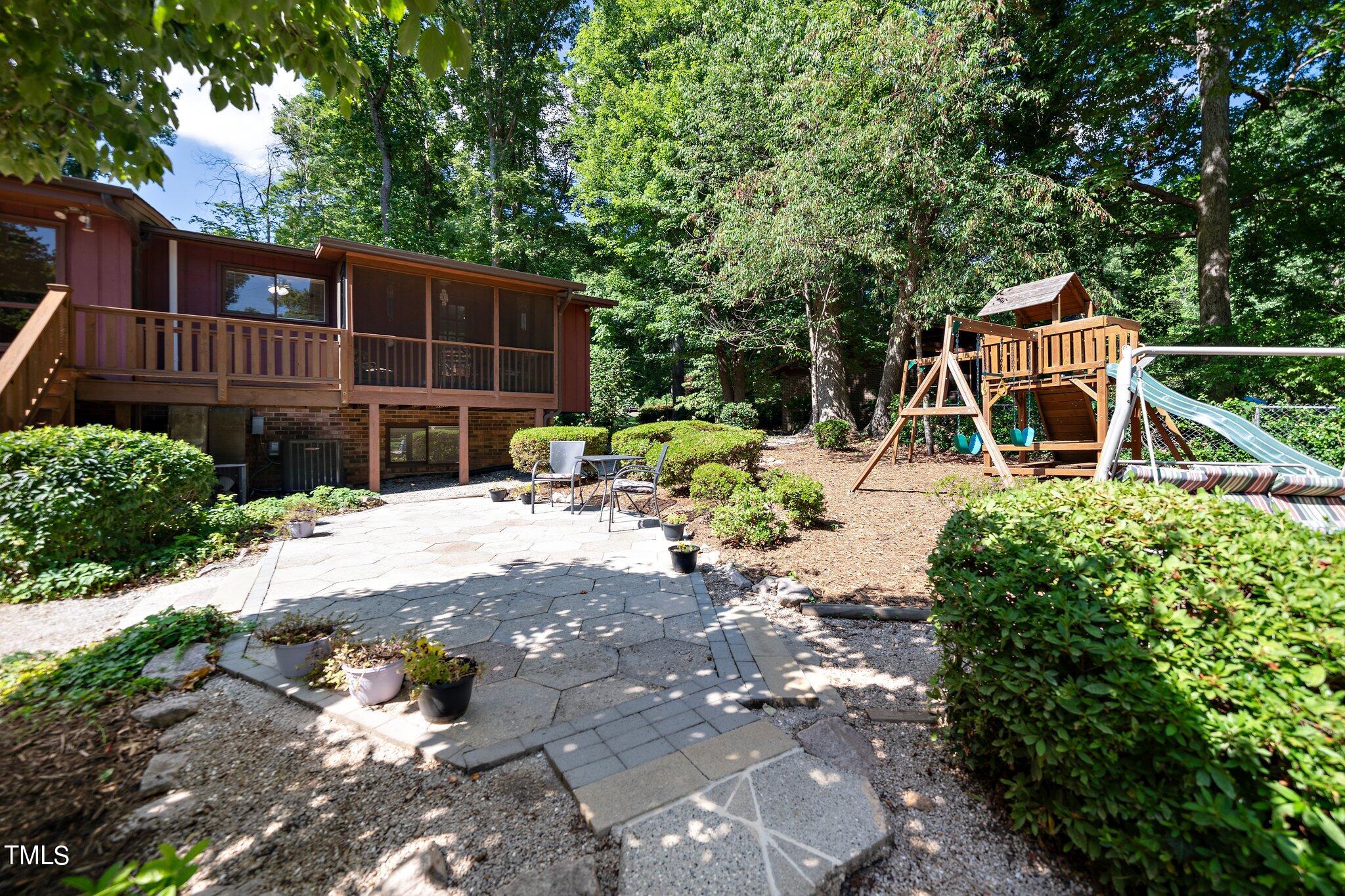 6406 Arnold Road Raleigh, NC 27607 - Photo 16 of 44 a view of backyard with deck and seating space