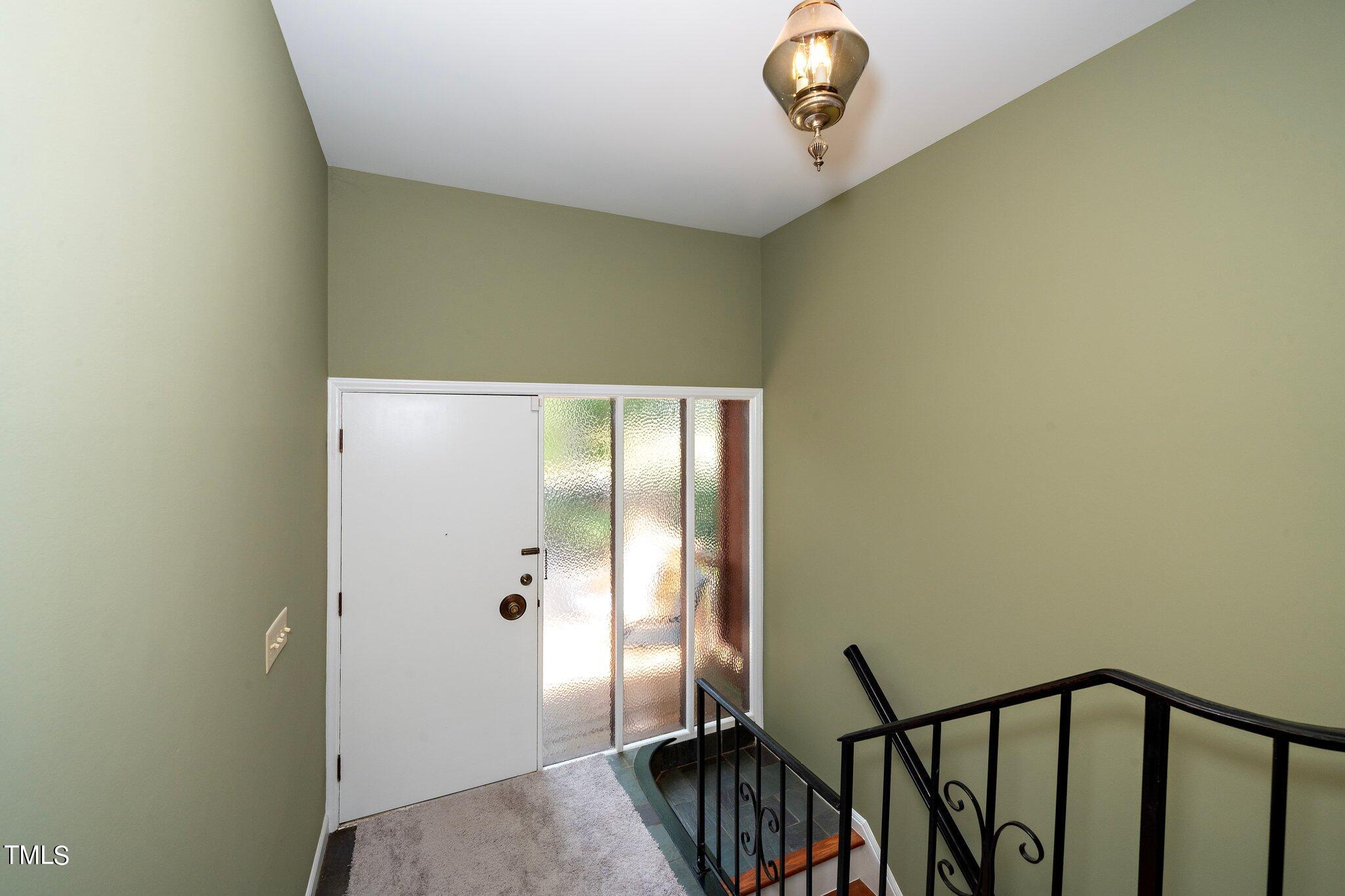 6406 Arnold Road Raleigh, NC 27607 - Photo 20 of 44 a view of a hallway with painted walls