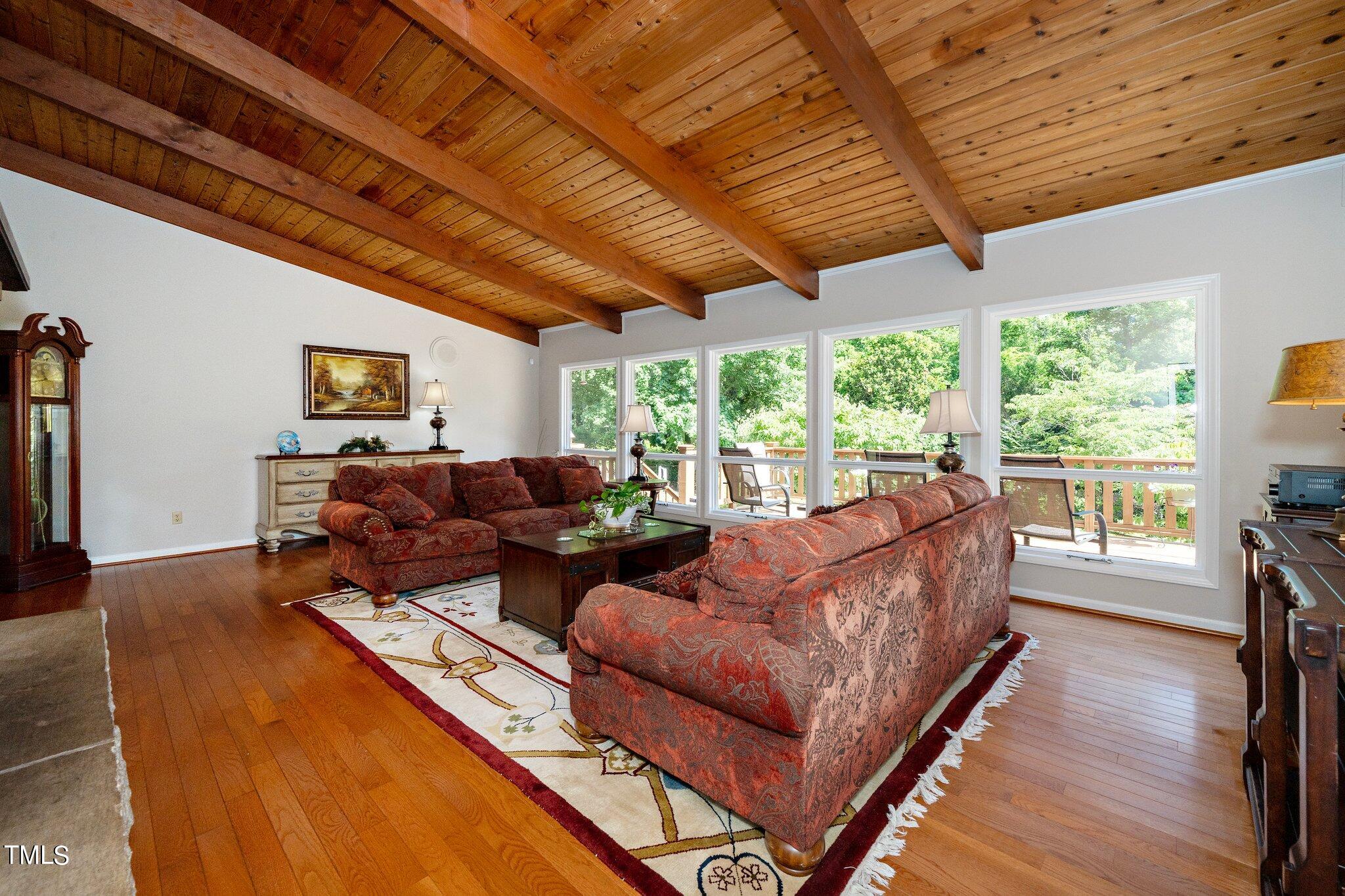 6406 Arnold Road Raleigh, NC 27607 - Photo 26 of 44 a living room with furniture and a large window