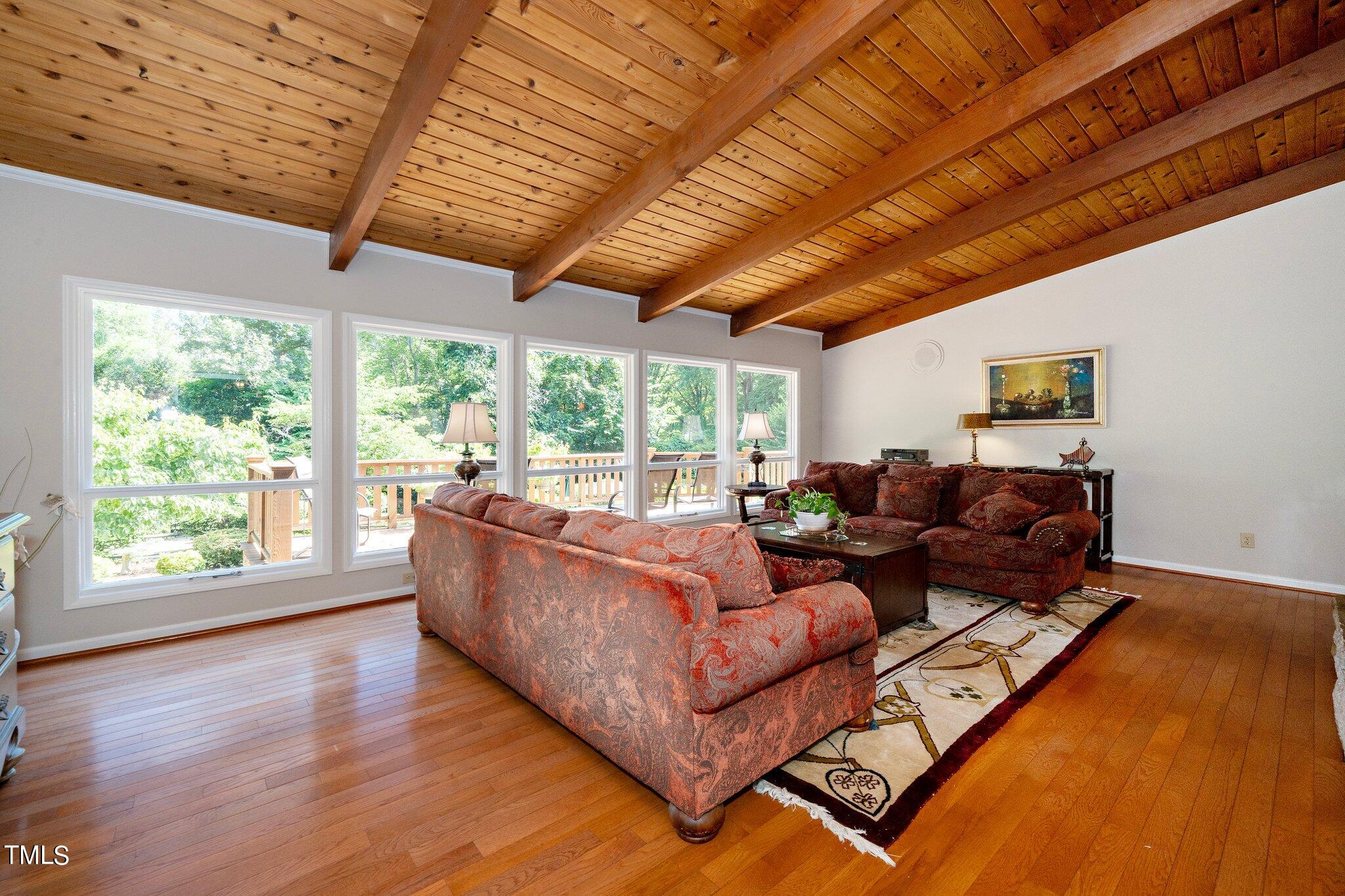 6406 Arnold Road Raleigh, NC 27607 - Photo 28 of 44 a living room with furniture and a large window