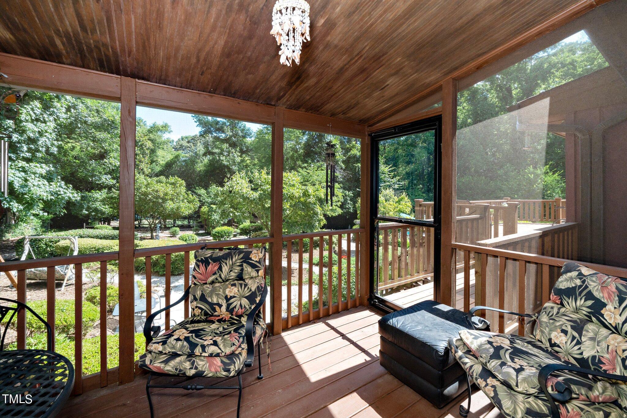 6406 Arnold Road Raleigh, NC 27607 - Photo 32 of 44 a balcony with wooden floor outdoor seating