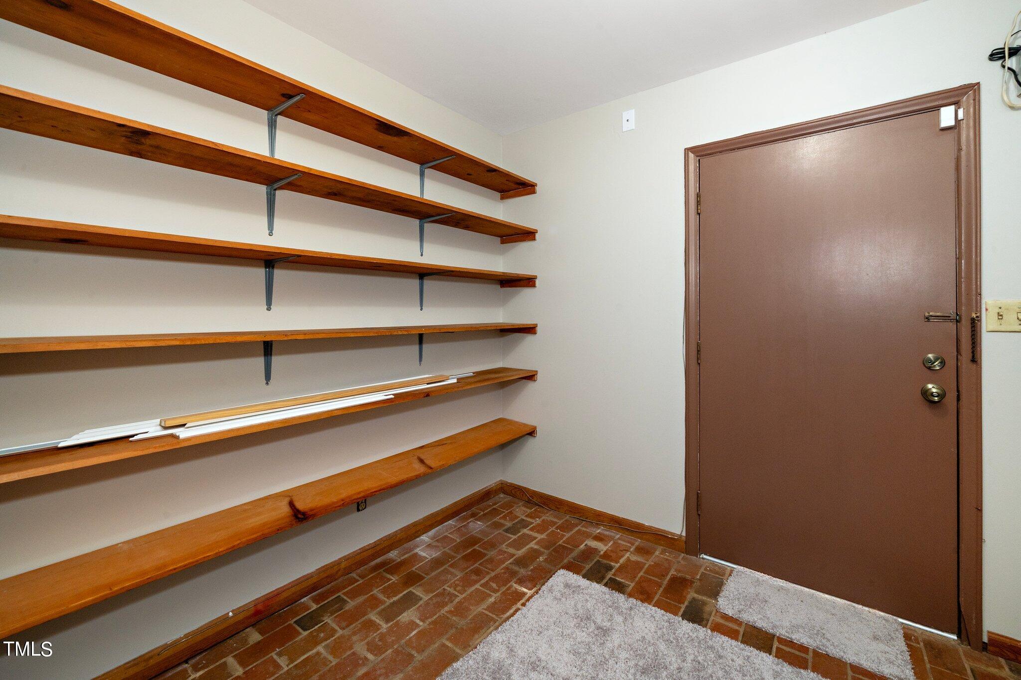 6406 Arnold Road Raleigh, NC 27607 - Photo 44 of 44 a view of a room with rack on the wall