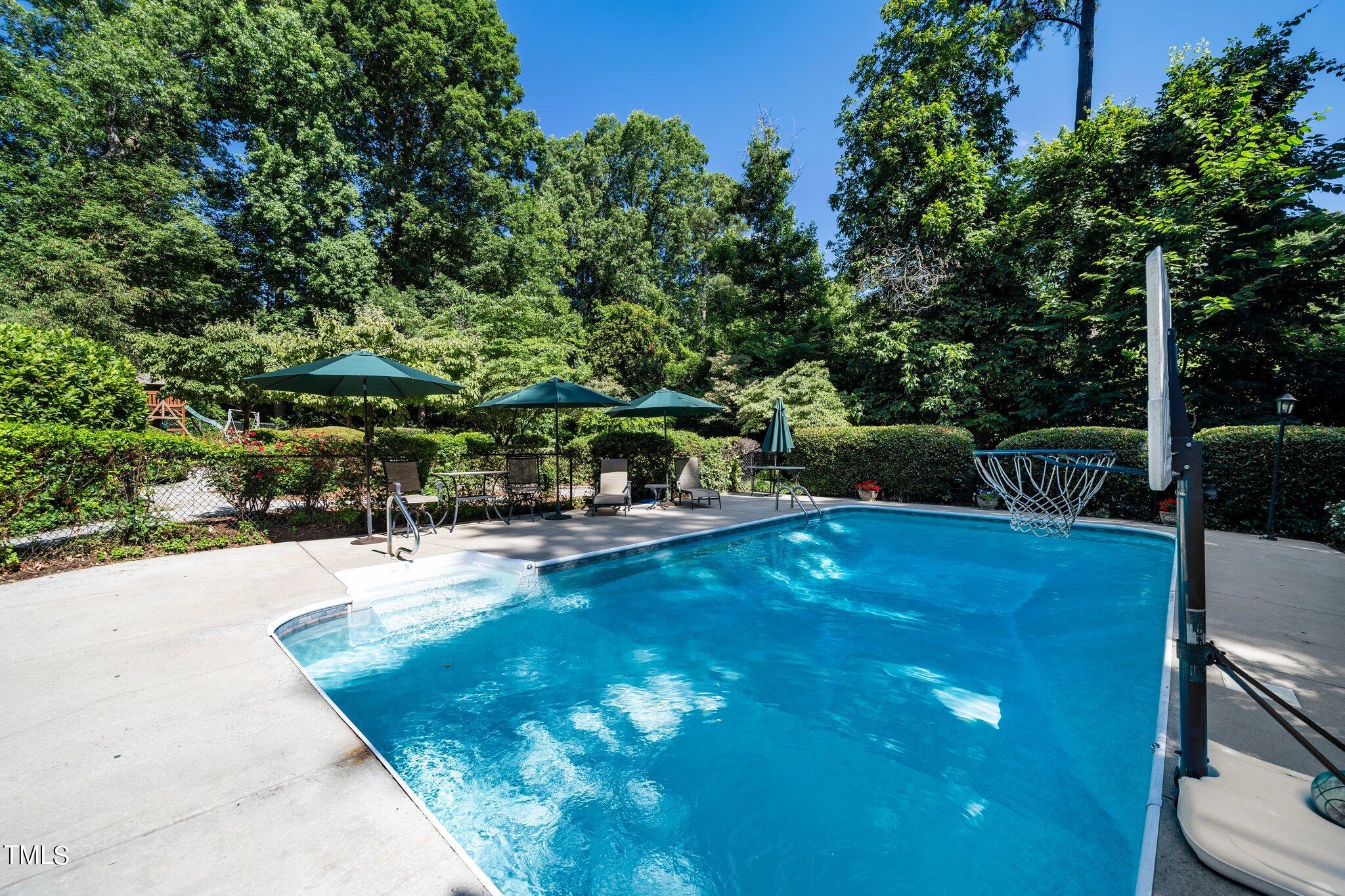 6406 Arnold Road Raleigh, NC 27607 - Photo 7 of 44 a view of a backyard with swimming pool