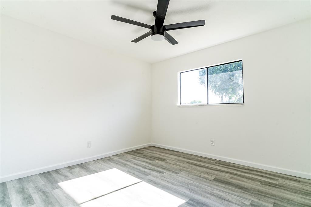 5000 Brandenburg Lane The Colony, TX 75056 - Photo 12 of 14 a view of empty room with wooden floor