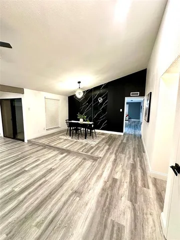 a bedroom with a bed and chair