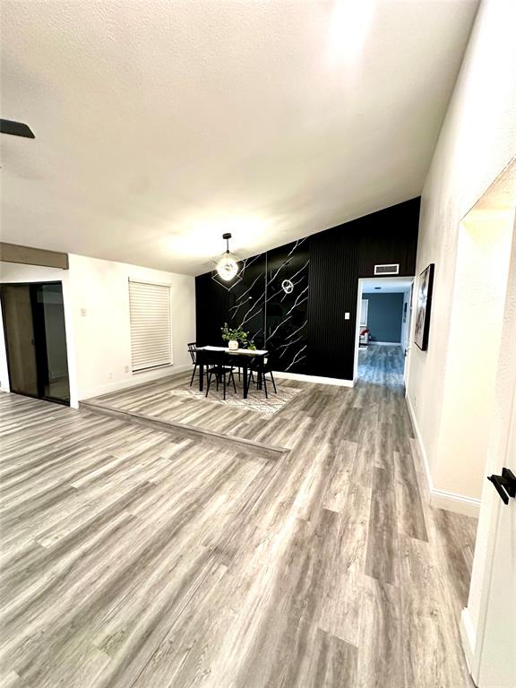 5000 Brandenburg Lane The Colony, TX 75056 - Photo 4 of 14 a bedroom with a bed and chair