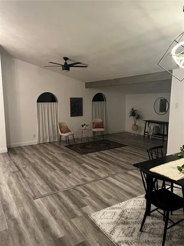 a view of a livingroom with furniture and chandelier