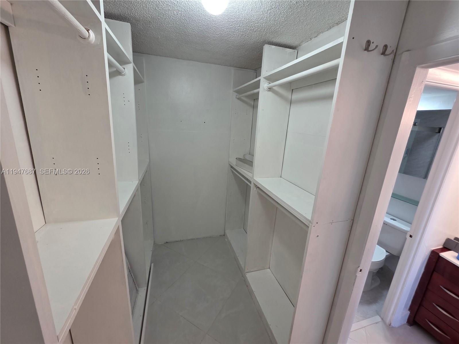 8307 Southwest 142nd Avenue, Unit E108 Miami, FL 33183 - Photo 14 of 22 a view of closet
