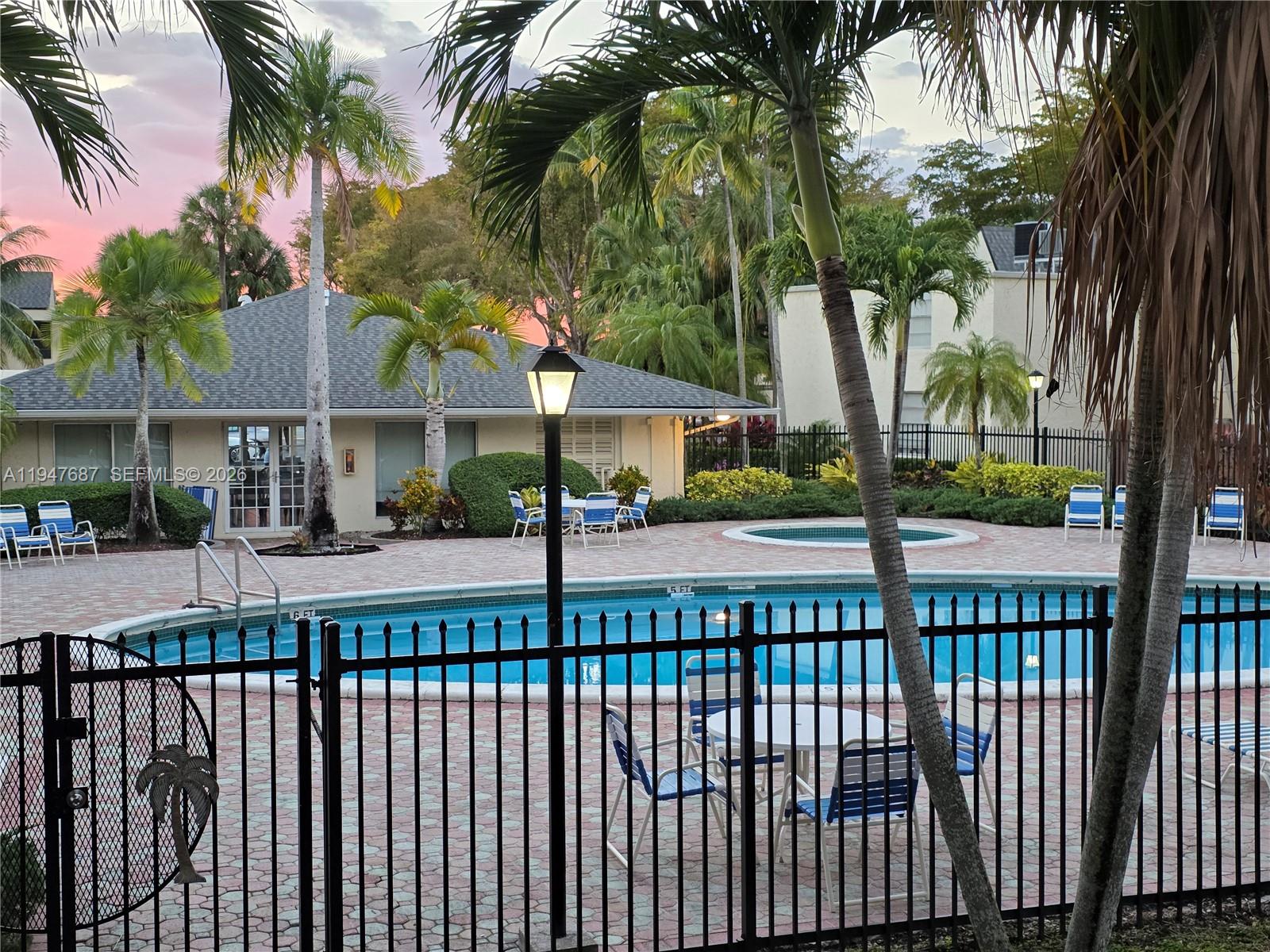 8307 Southwest 142nd Avenue, Unit E108 Miami, FL 33183 - Photo 2 of 22 a view of a street and a yard