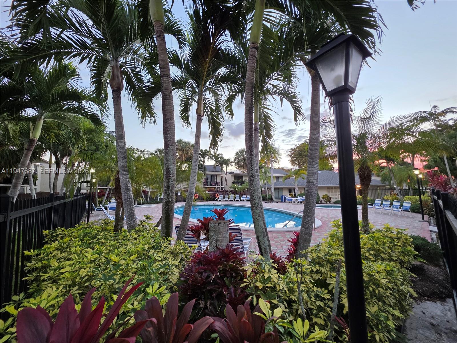 8307 Southwest 142nd Avenue, Unit E108 Miami, FL 33183 - Photo 4 of 22 a view of a potted plants on a park