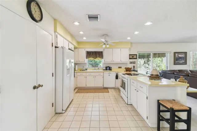 a kitchen with a sink cabinets and stainless steel appliances