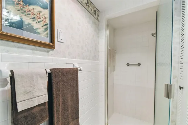 a bathroom with a sink mirror and vanity