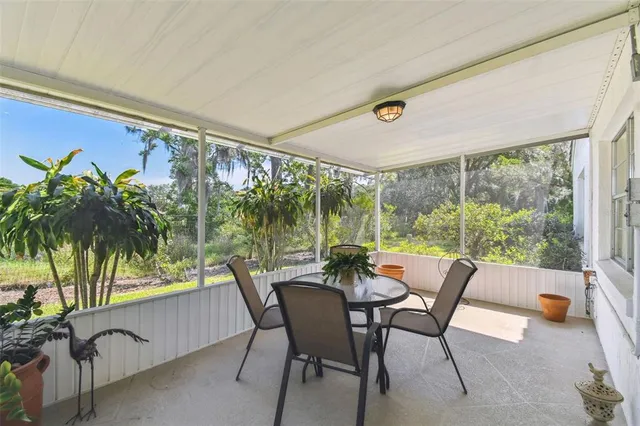 a dining room with furniture and a window