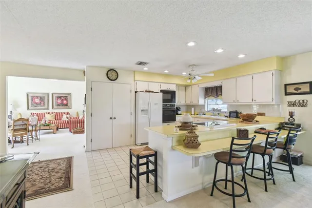 a view of a kitchen and dining room