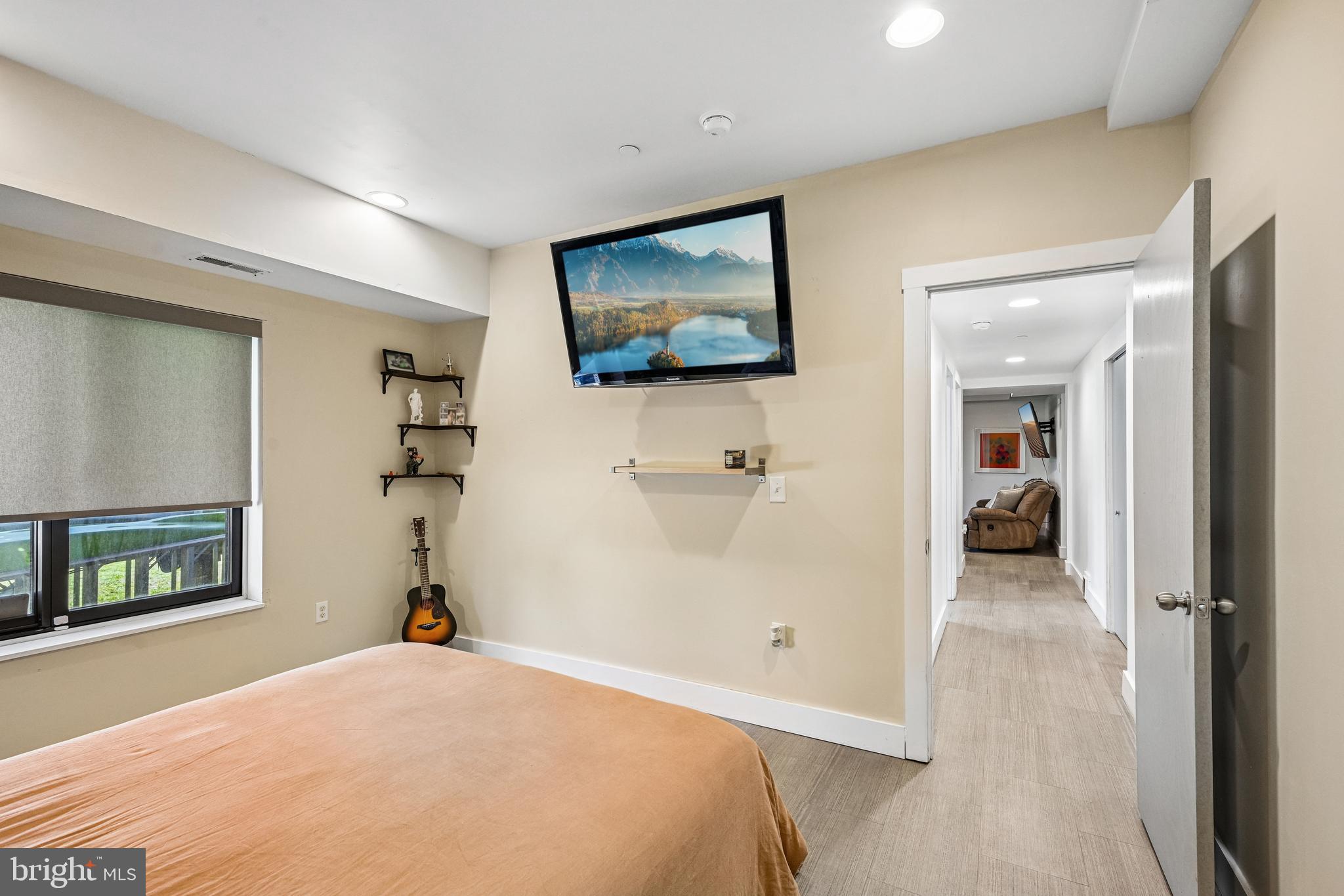 11 Forklanding Road Cinnaminson, NJ 08077 - Photo 45 of 77 a bedroom with a bed and a flat screen tv