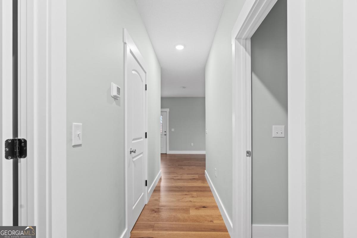 596 Beach Road Baxley, GA 31513 - Photo 11 of 17 a view of a hallway with white walls