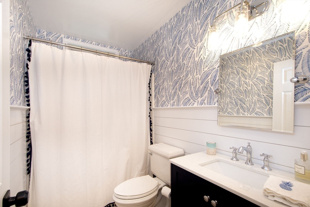 21 Union Street Marshfield, MA 02050 - Photo 12 of 31 a bathroom with a sink and a mirror