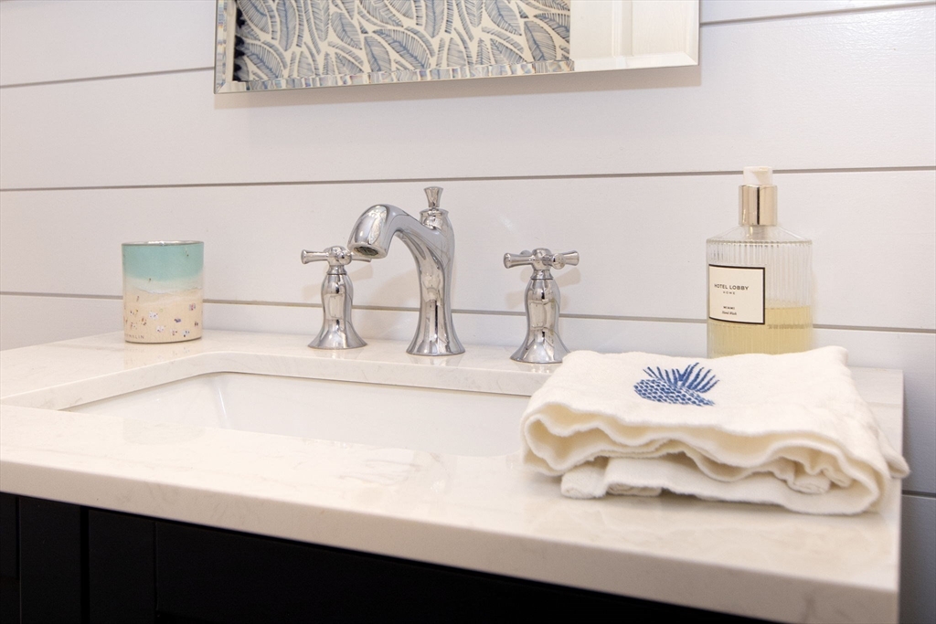 21 Union Street Marshfield, MA 02050 - Photo 13 of 31 a bathroom with a sink and a mirror