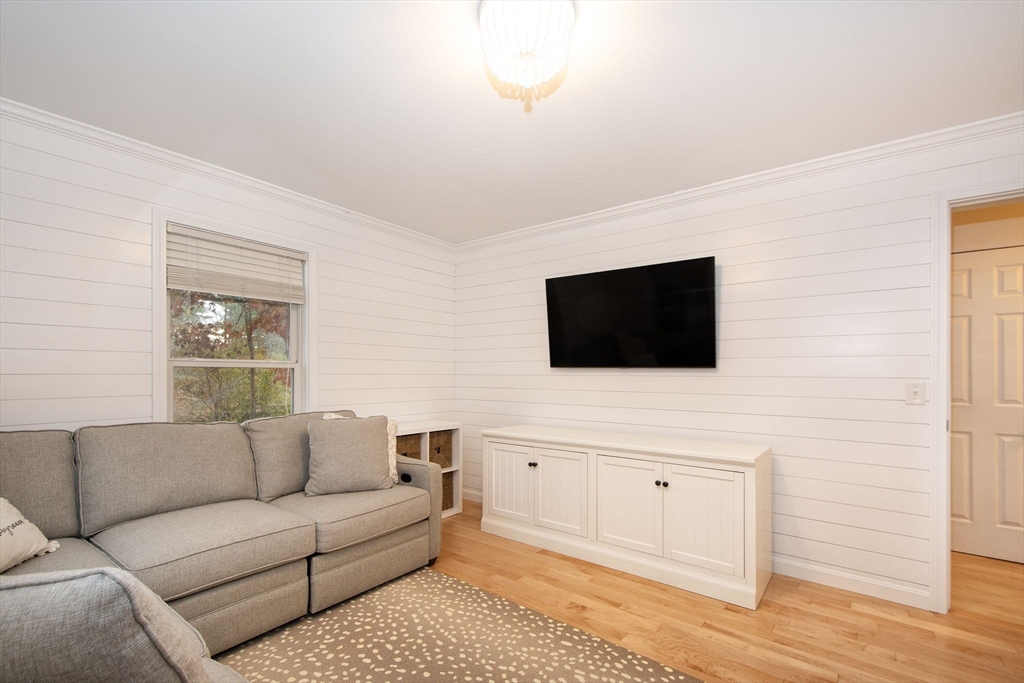 21 Union Street Marshfield, MA 02050 - Photo 16 of 31 a living room with furniture and a flat screen tv