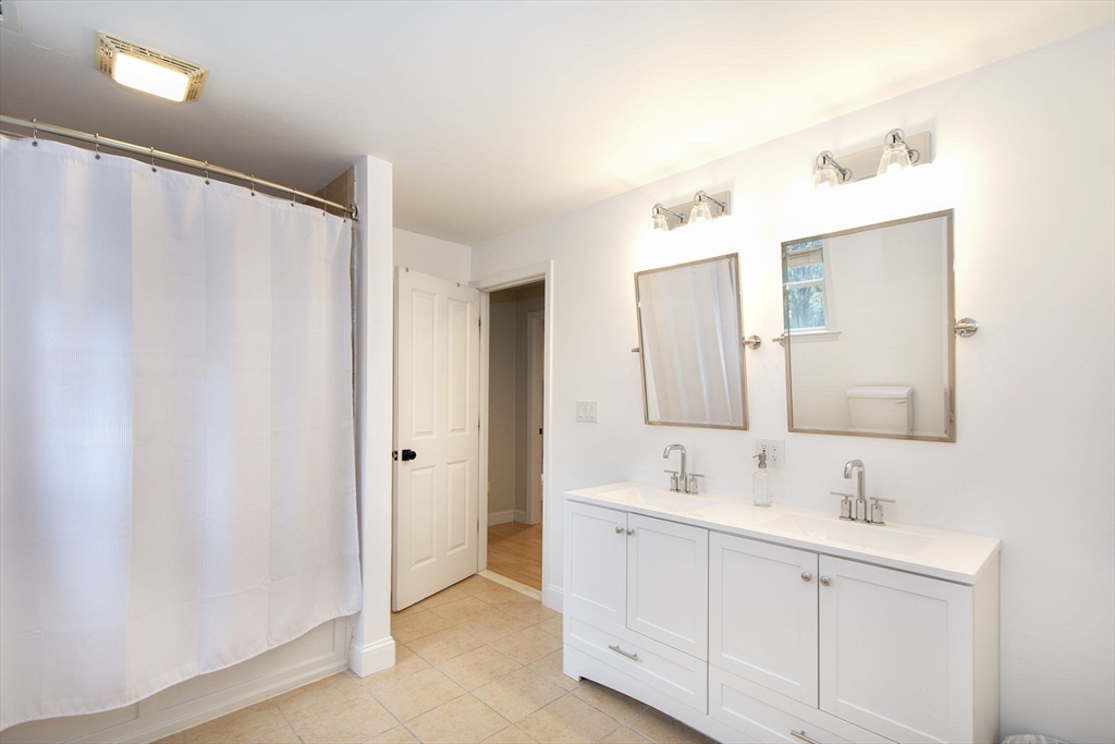21 Union Street Marshfield, MA 02050 - Photo 21 of 31 a bathroom with a double vanity sink mirror and