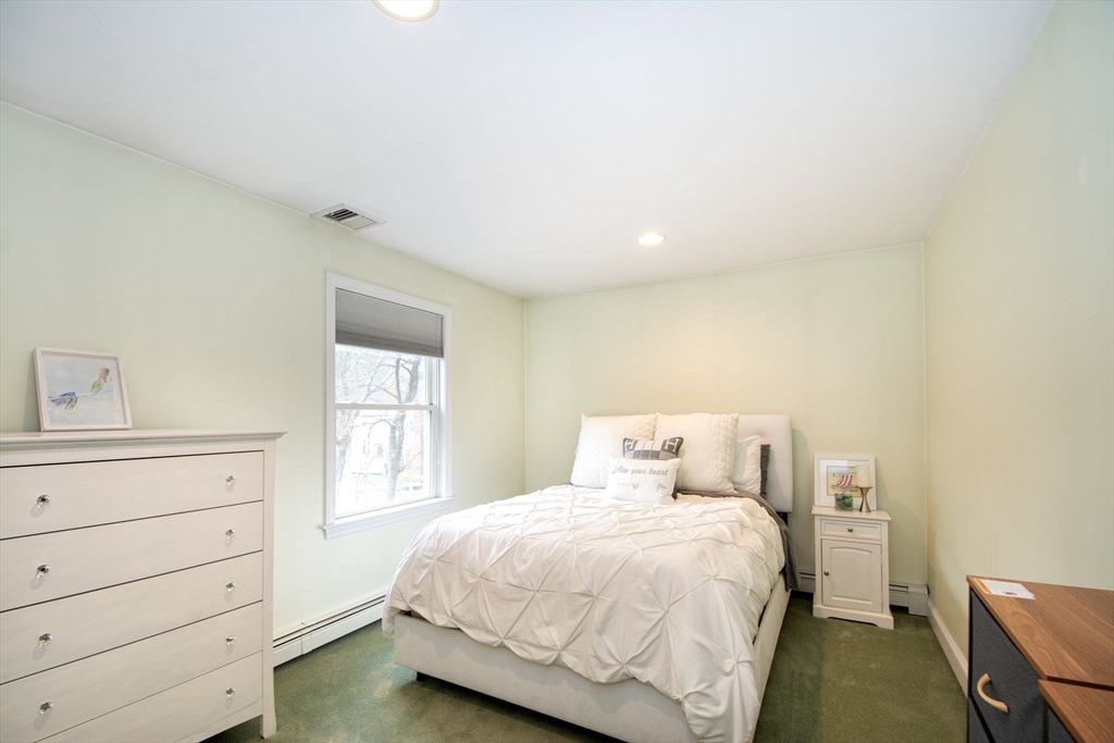 21 Union Street Marshfield, MA 02050 - Photo 24 of 31 a bedroom with a bed and a window