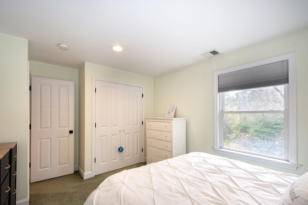 21 Union Street Marshfield, MA 02050 - Photo 25 of 31 a bedroom with a bed and a window