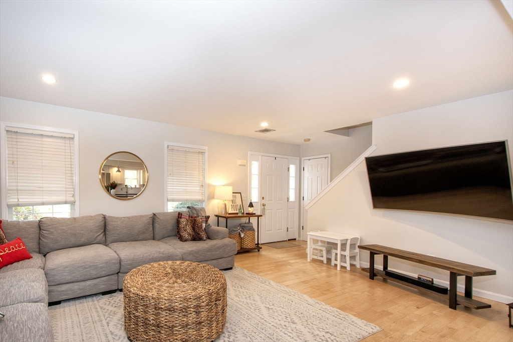 21 Union Street Marshfield, MA 02050 - Photo 5 of 31 a living room with furniture and a flat screen tv