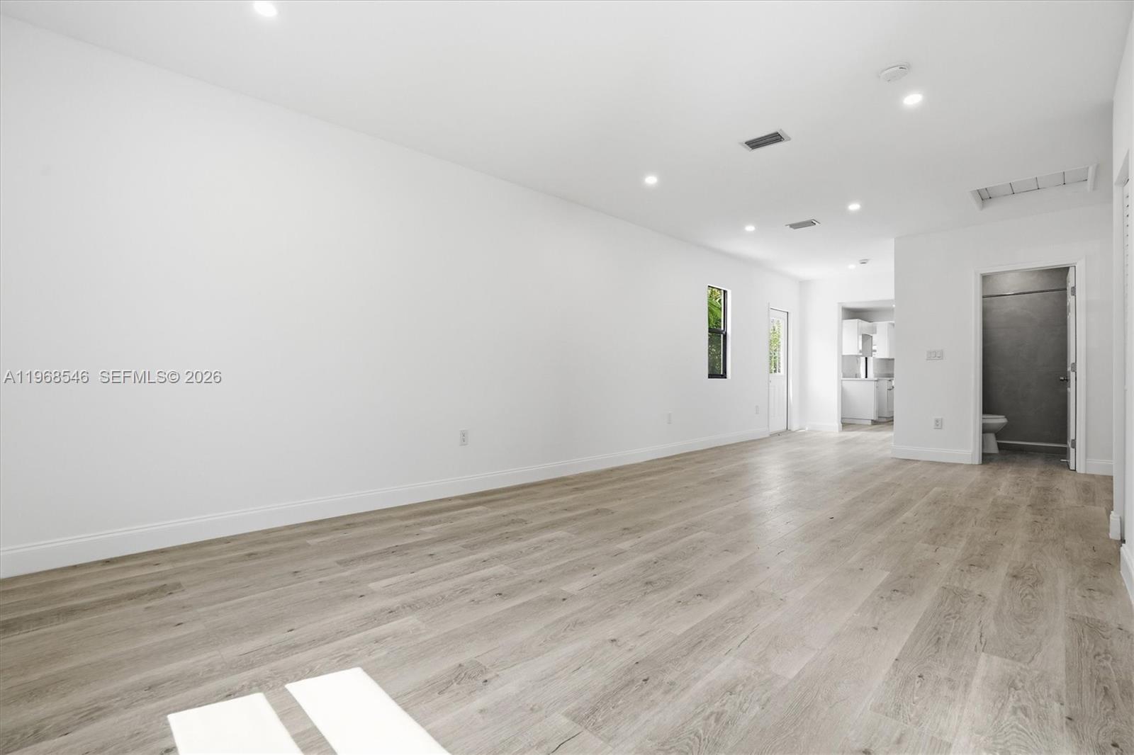 4237 Southwest 7th Street Miami, FL 33134 - Photo 2 of 31 wooden floor in an empty room