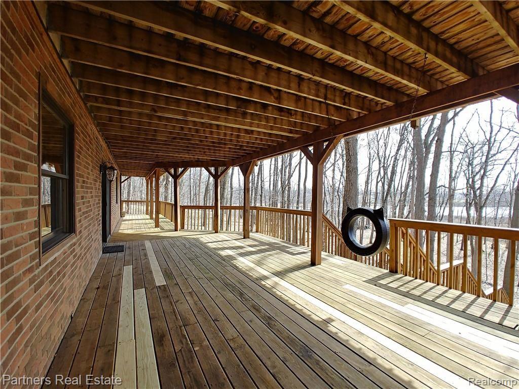 2715 West Coon Lake Road Howell, MI 48843 - Photo 44 of 54 17f1. Overlooking the Private Wooded Setting with Lake Views as an added bonus.