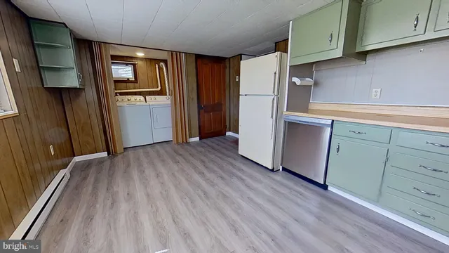 a view of kitchen with wooden floor