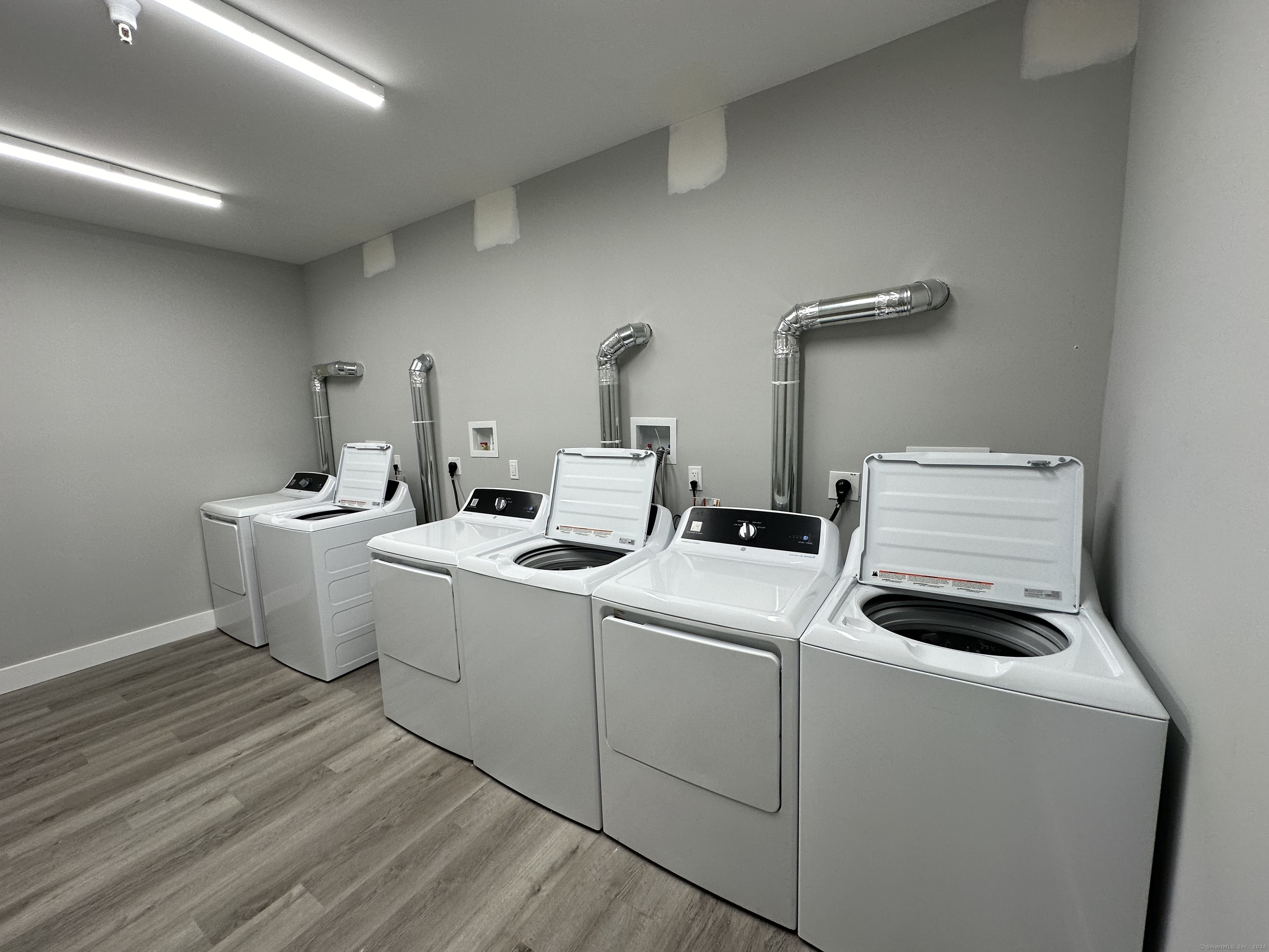528 Black Rock Turnpike, Unit 108 Fairfield, CT 06825 - Photo 17 of 26 a utility room with dryer and washer