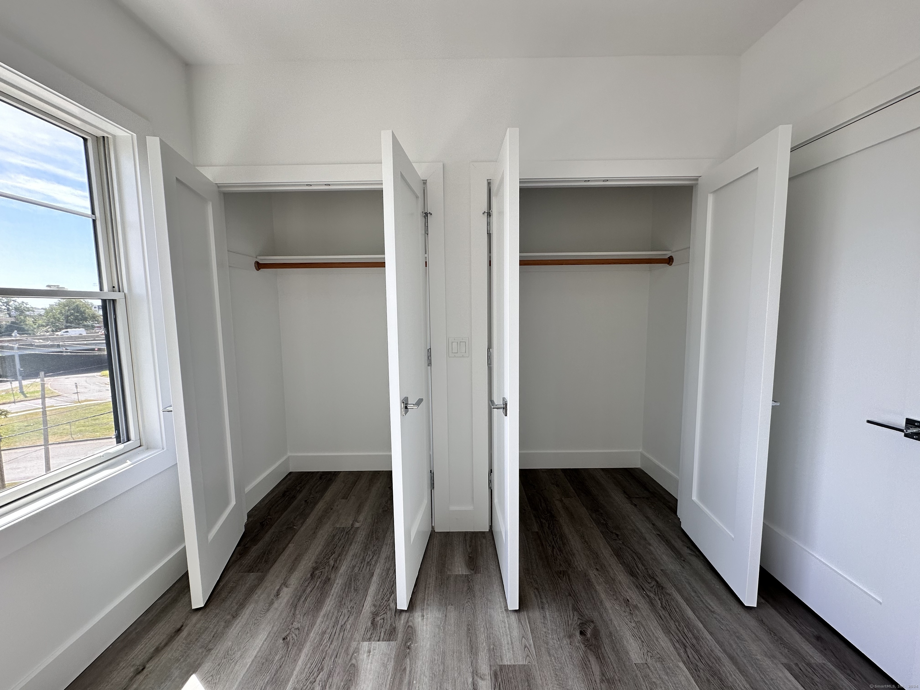 528 Black Rock Turnpike, Unit 108 Fairfield, CT 06825 - Photo 26 of 26 a view of wooden floor in a room