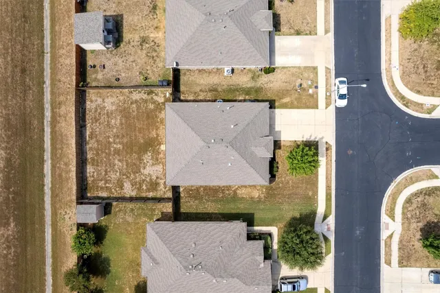 an aerial view of a house with swimming pool