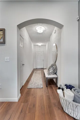 a view of a livingroom with furniture and wooden floor
