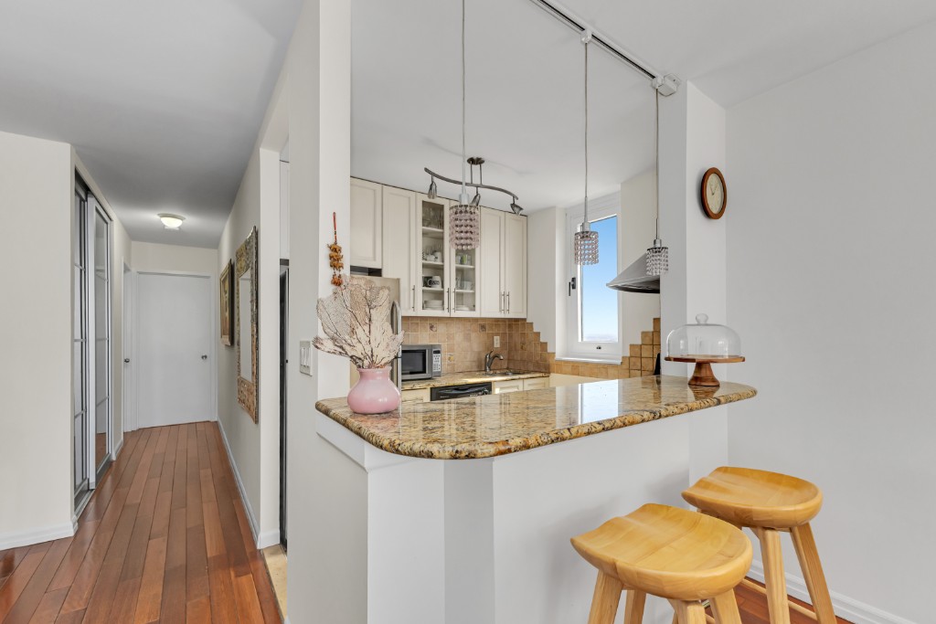 200 East 89th Street, Unit 37D Manhattan, NY 10128 - Photo 11 of 35 a bathroom with a sink a toilet and shower