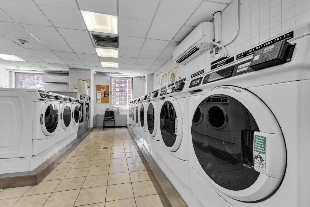 200 East 89th Street, Unit 37D Manhattan, NY 10128 - Photo 27 of 35 a utility room with dryer and washer