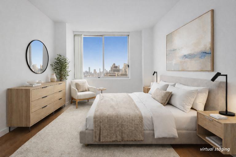 200 East 89th Street, Unit 37D Manhattan, NY 10128 - Photo 7 of 35 a bedroom with bed and a large mirror