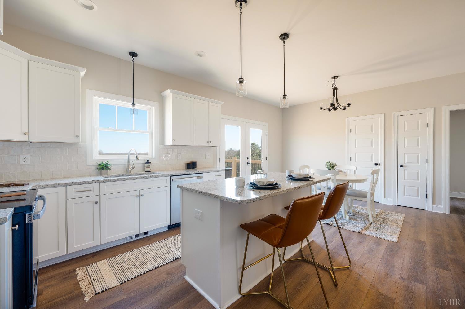 10528 Leesville Road Lynch Station, VA 24571 - Photo 11 of 58 a kitchen with stainless steel appliances granite countertop a sink a stove a refrigerator and island with wooden floor