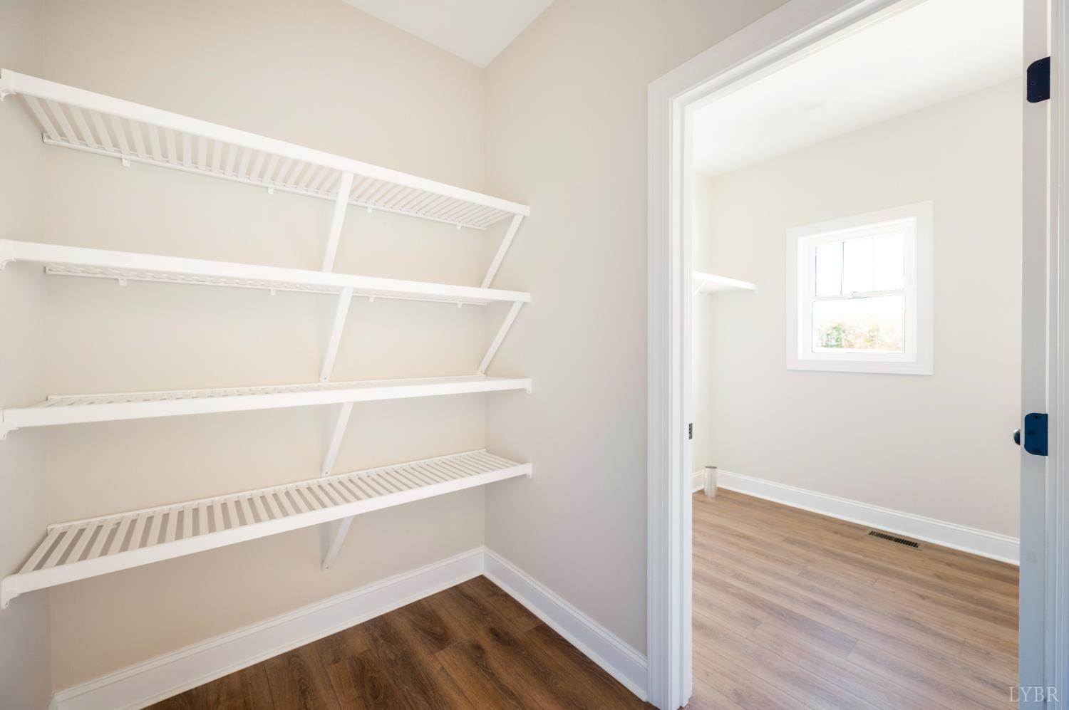 10528 Leesville Road Lynch Station, VA 24571 - Photo 16 of 58 a view of an empty room with wooden floor and a window