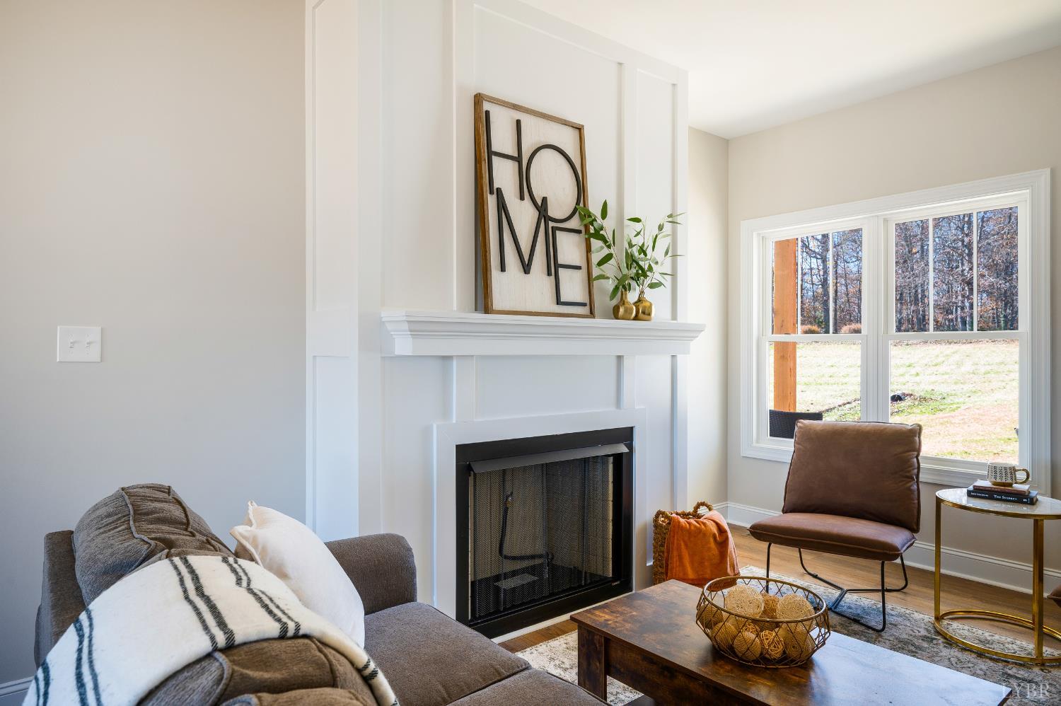 10528 Leesville Road Lynch Station, VA 24571 - Photo 25 of 58 a living room with furniture and a fireplace