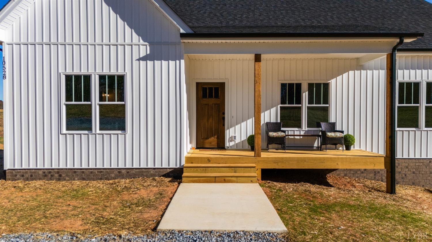 10528 Leesville Road Lynch Station, VA 24571 - Photo 48 of 58 a view of a house with wooden floor and floor to ceiling window
