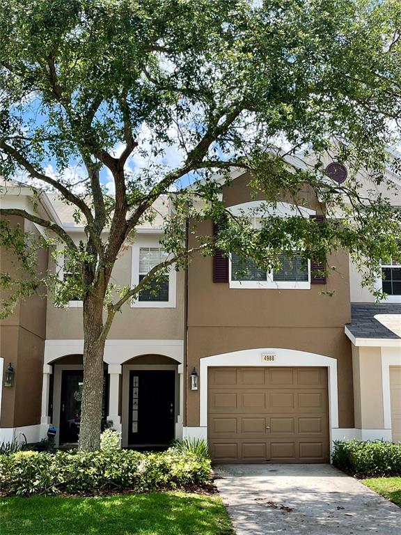 4988 Pond Ridge Drive Riverview, FL 33578 - Photo 1 of 1 a front view of a house with a garden