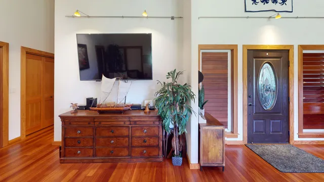 a room with furniture and a potted plant