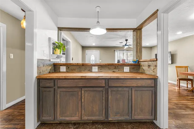 a kitchen with a refrigerator a sink dishwasher and a microwave oven