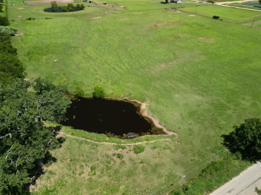 9100 Nix Road Tolar, TX 76476 - Photo 4 of 13 a big yard with lots of green space