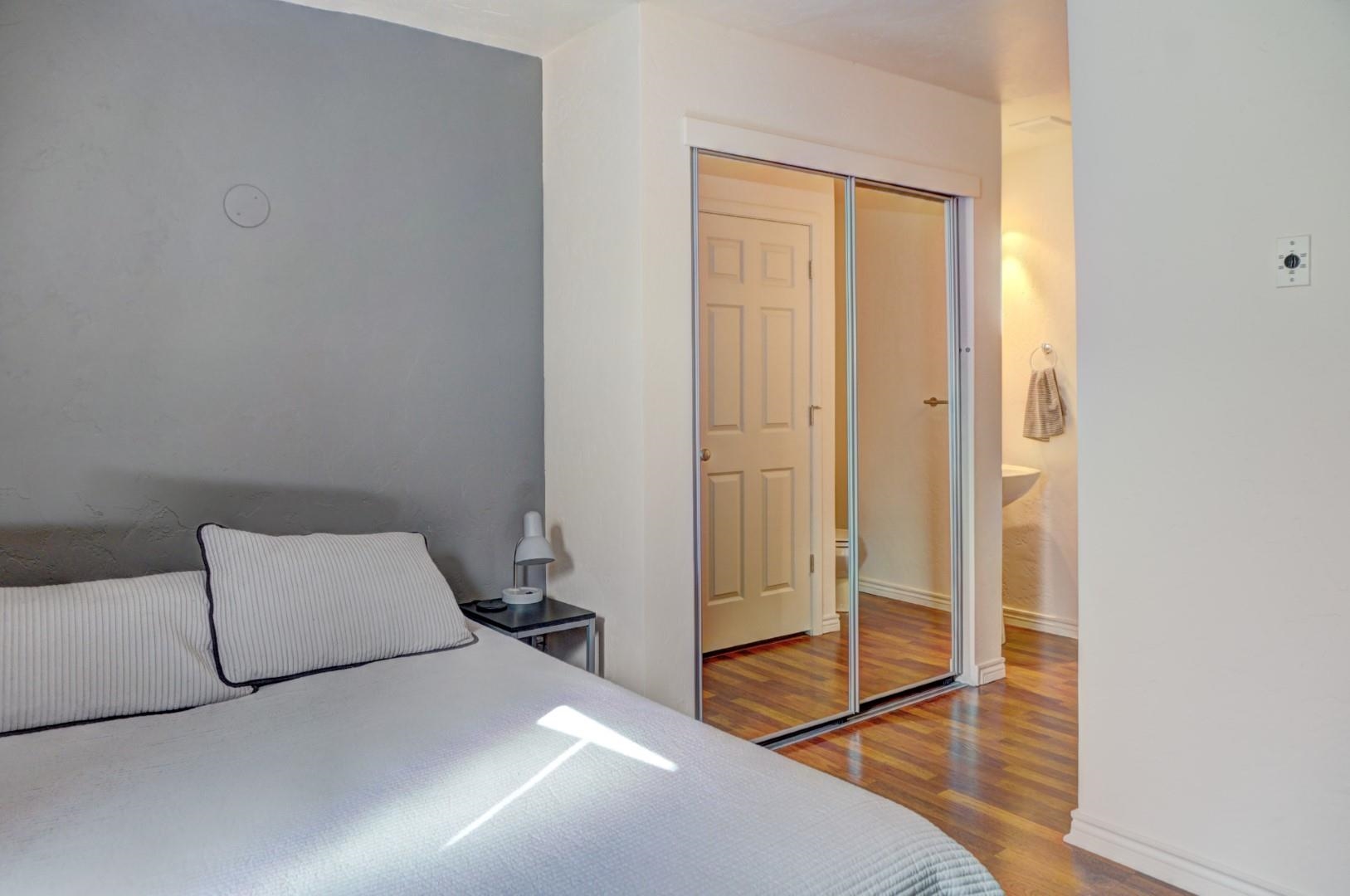 948 Northern Way, Unit 4 Grand Junction, CO 81506 - Photo 11 of 15 a bedroom with a bed and a door