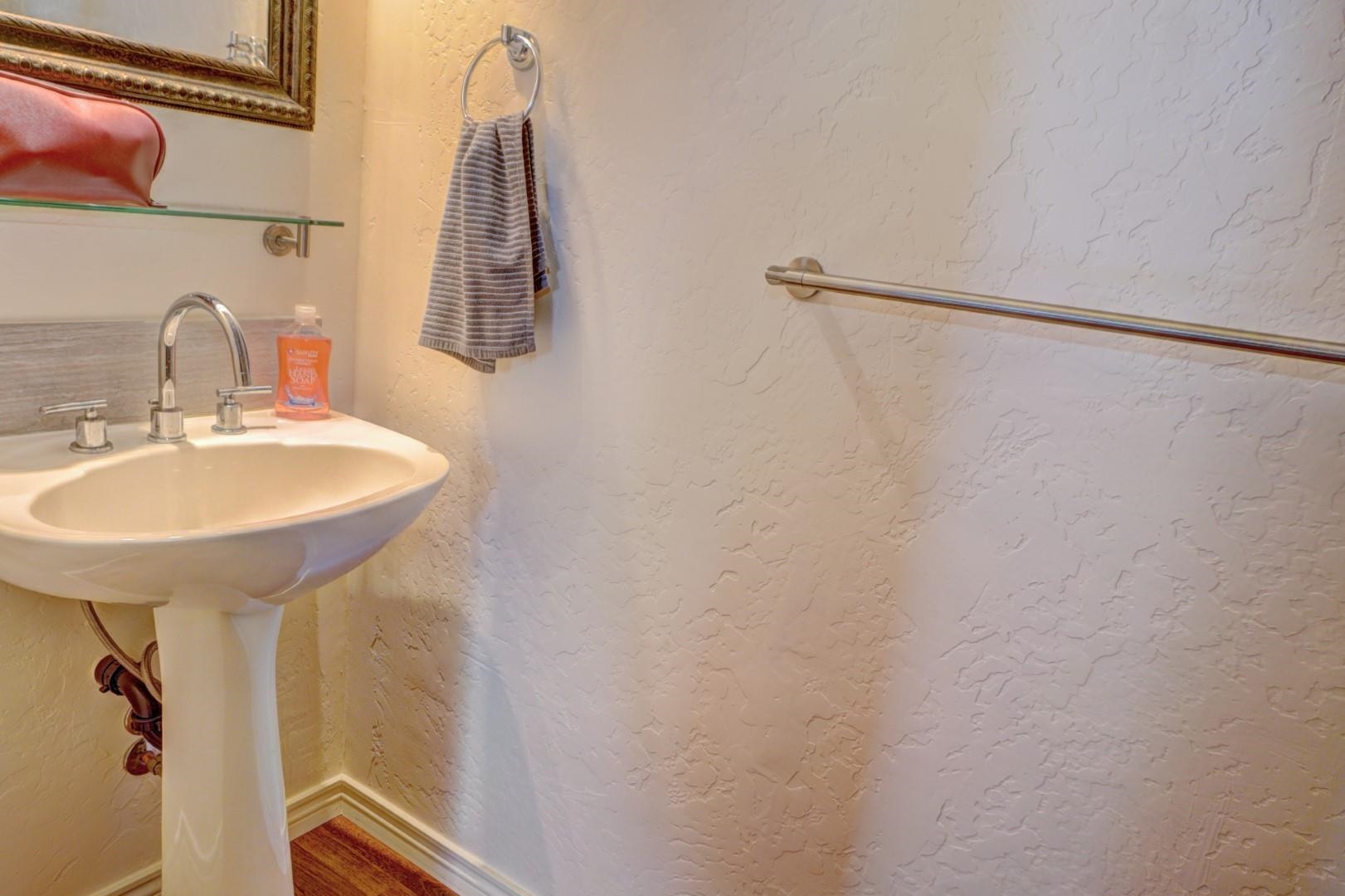 948 Northern Way, Unit 4 Grand Junction, CO 81506 - Photo 12 of 15 a bathroom with a sink and mirror