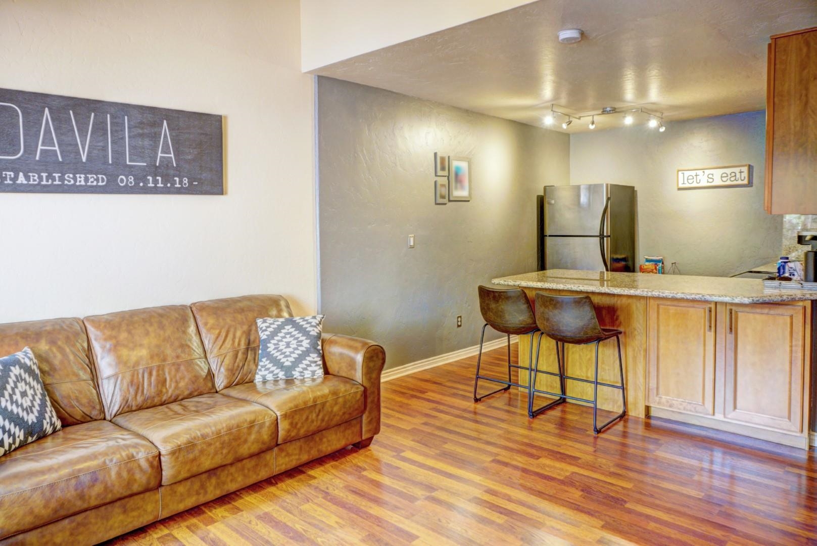 948 Northern Way, Unit 4 Grand Junction, CO 81506 - Photo 3 of 15 a living room with furniture and a wooden floor
